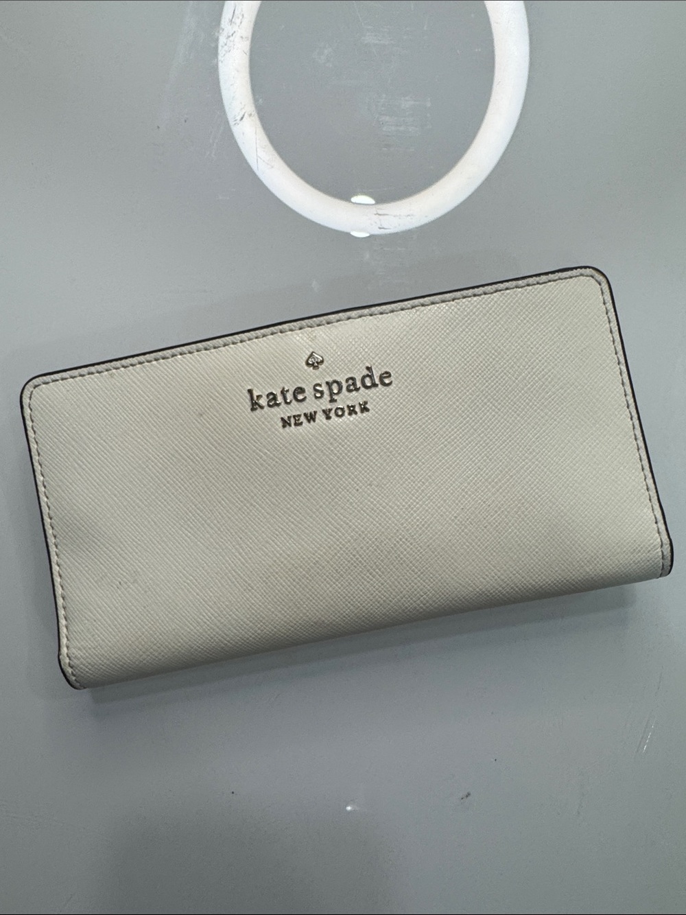 kate spade Cream Saffiano Zip Wallet with Gold Logo
